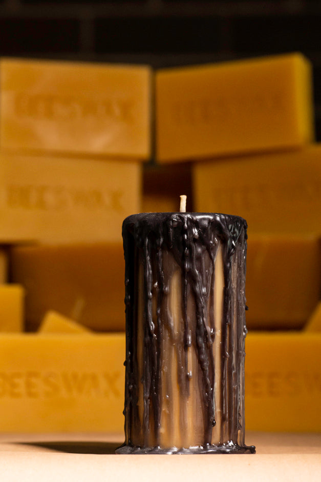 Drippy beeswax black pillar candle