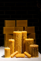Drippy beeswax pillar candles and beeswax bars