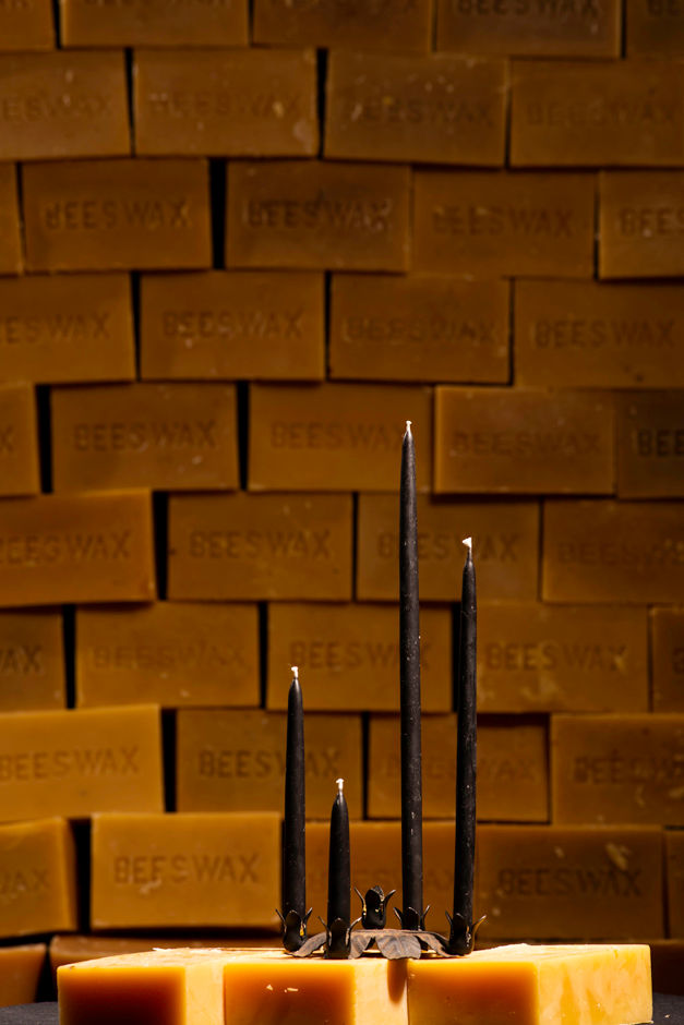 waxing and raining beeswax slim candlesticks black