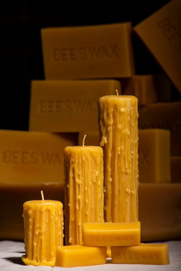 Drippy beeswax pillar candles and beeswax bars