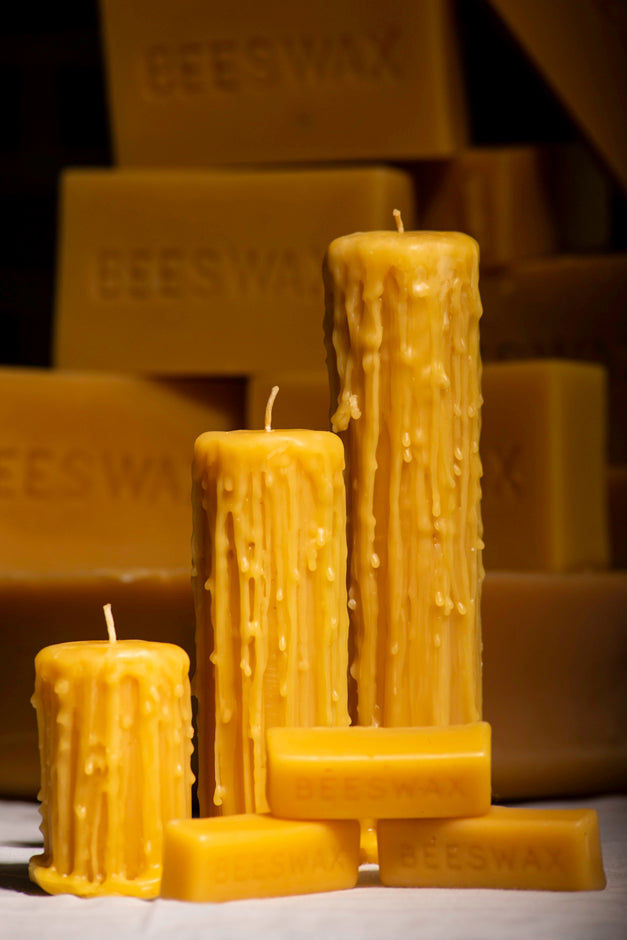 Drippy beeswax pillar candles and beeswax bars